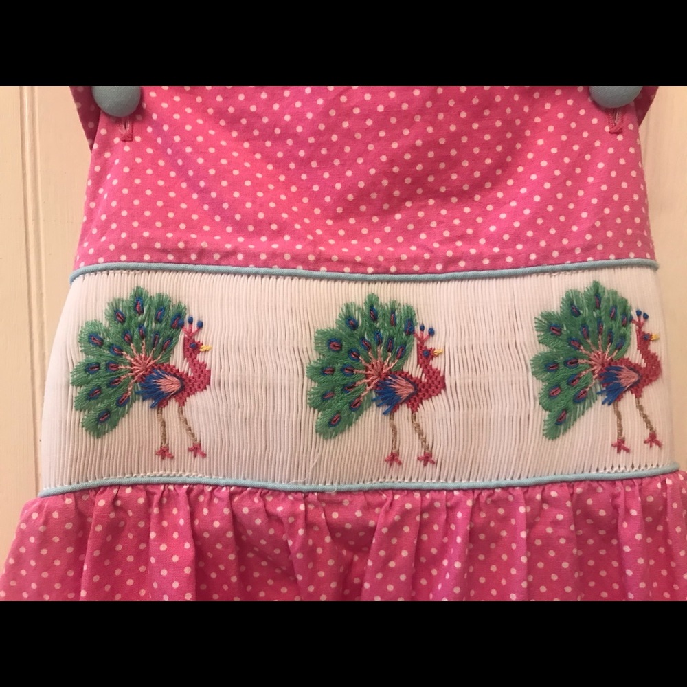Pink smocked peacock dress size 7